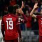 Robert Lewandowski (R) celebrates his early goal for Bayern Munich, but later had a weak penalty attempt saved