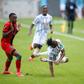 Christian Kouame (R) of the Ivory Coast is fouled by Charles Petro (L) of Malawi during a World Cup qualifier in Soweto, South Africa, on Friday.