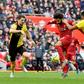 Liverpool star Mohamed Salah (C) shoots as two Watford defenders close in during a Premier League  match at the weekend