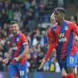 Crystal Palace's Wilfried Zaha (C) celebrates scoring against Tottenham