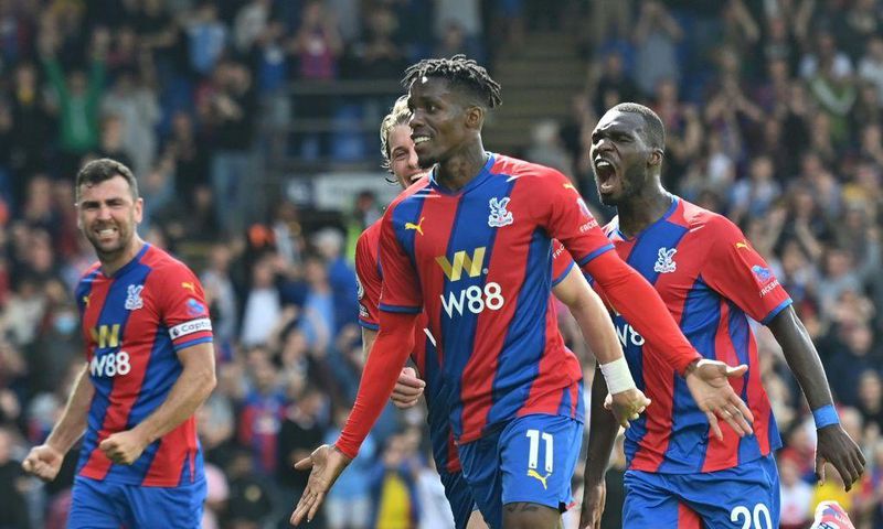 Crystal Palace's Wilfried Zaha (C) celebrates scoring against Tottenham