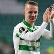 Scotland forward Leigh Griffiths has been charged by police for kicking a smoke bomb back into the crowd