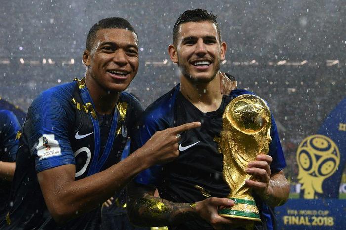 Lucas Hernandez (right) with Kylian Mbappe after winning the World Cup in 2018