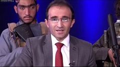 Armed Taliban militants storm TV studio, surround presenter with guns while he reads news