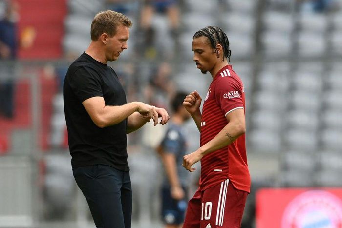 Bayern Munich coach Julian Nagelsmann (L) says Leroy Sane (R) is better off playing on the left wing
