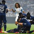 Moment of worry: Bordeaux players surround Nigerian forward Samuel Kalu after he faints on the pitch in Marseille