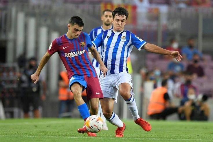 Pedri (left) has agreed a contract extension with Barcelona until 2026