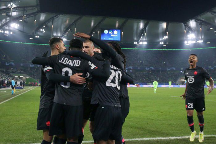 Lille players celebrate during their win over Wolfsburg on Wednesday