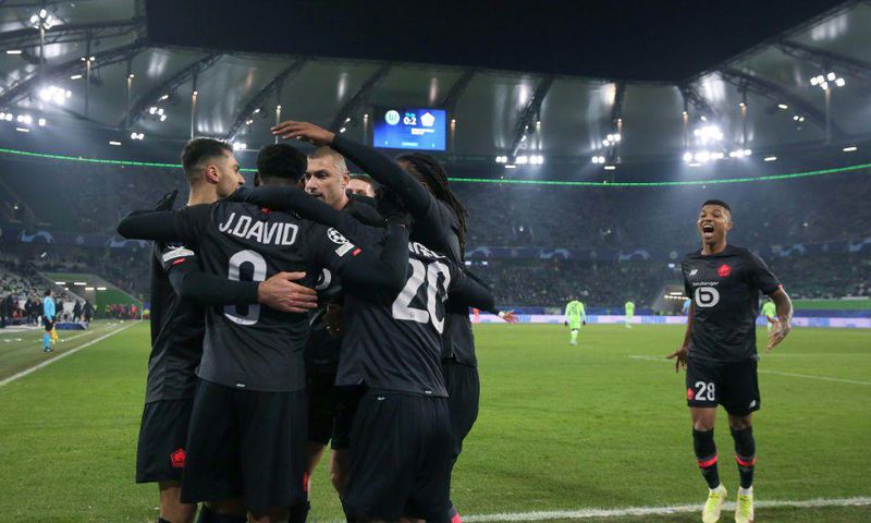 Lille players celebrate during their win over Wolfsburg on Wednesday