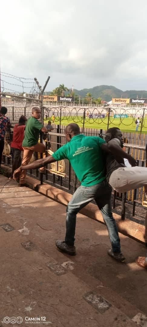 Journalist being carried out by fans