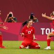 Canada's Jessie Fleming (C) celebrates after scoring the winning goal against the USA