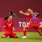Canada's Jessie Fleming (C) celebrates after scoring the winning goal against the USA