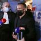 French football player Mathieu Valbuena (R), involved in a 'sex tape case', addresses media representatives next to lawyer Paul Albert Iweins (C) inside a court