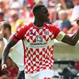 Mainz captain Moussa Niakhate celebrates scoring against Leipzig
