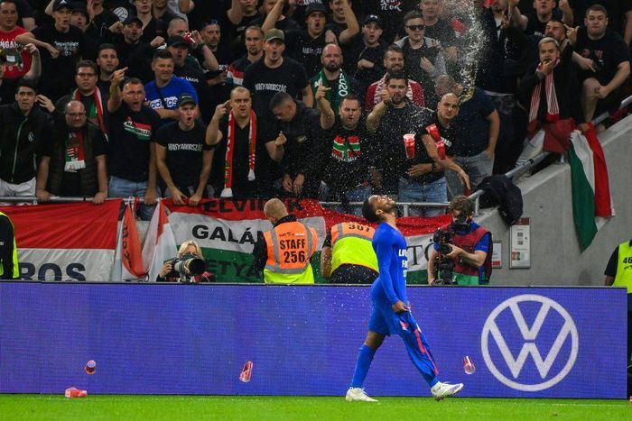 Hungary fans react throwing cups of beer at England forward Raheem Sterling