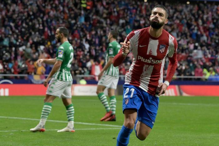 Yannick Carrasco celebrates giving Atletico Madrid the lead against Real Betis