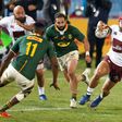 Georgia wing Akaki Tabutsadze (R) runs with the ball in a Test against South Africa on Friday in Pretoria.