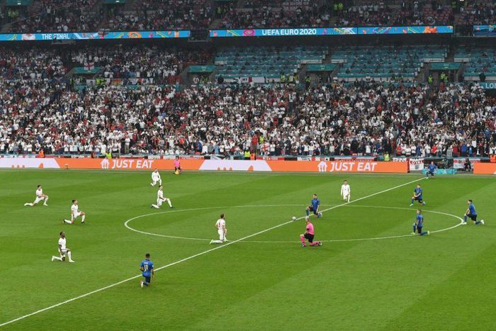 Players take a knee ahead of the UEFA EURO 2020 final football match between Italy and England at Wembley Stadium on July 11