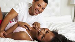 Couple having a good time in bed.