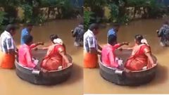Bride & groom float in a cooking pot to wedding as flooding kills 27 people (video)