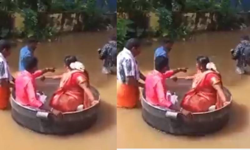 Bride & groom float in a cooking pot to wedding as flooding kills 27 people (video)