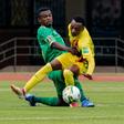 Zimbabwe forward Khama Billiat (R) contests possession with South Africa midfielder Teboho Mokoena (L) during a 2022 World Cup qualifier in Harare