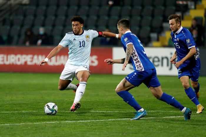 Che Adams (left) scored as Scotland secured a 2022 World Cup qualifying playoff in Moldova