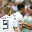 Departing Germany head coach Joachim Loew (R) wants to hold talks with midfielder Mesut Ozil (C)