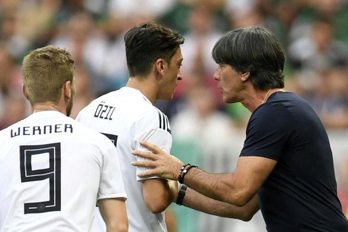 Departing Germany head coach Joachim Loew (R) wants to hold talks with midfielder Mesut Ozil (C)