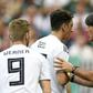 Departing Germany head coach Joachim Loew (R) wants to hold talks with midfielder Mesut Ozil (C)