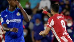 Luis Suarez (R) scored a late double for Atletico