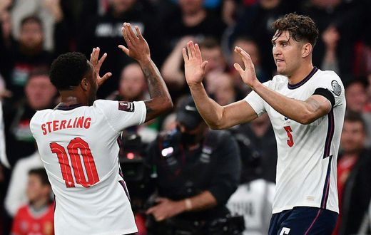 England defender John Stones (R) celebrates with Raheem Sterling