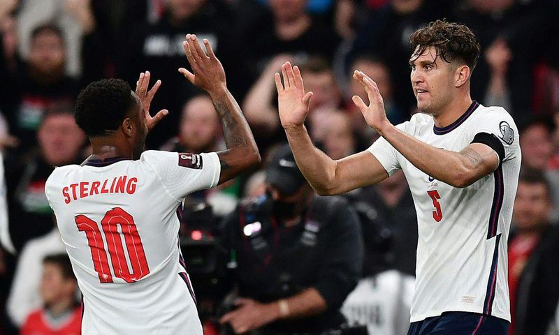 England defender John Stones (R) celebrates with Raheem Sterling