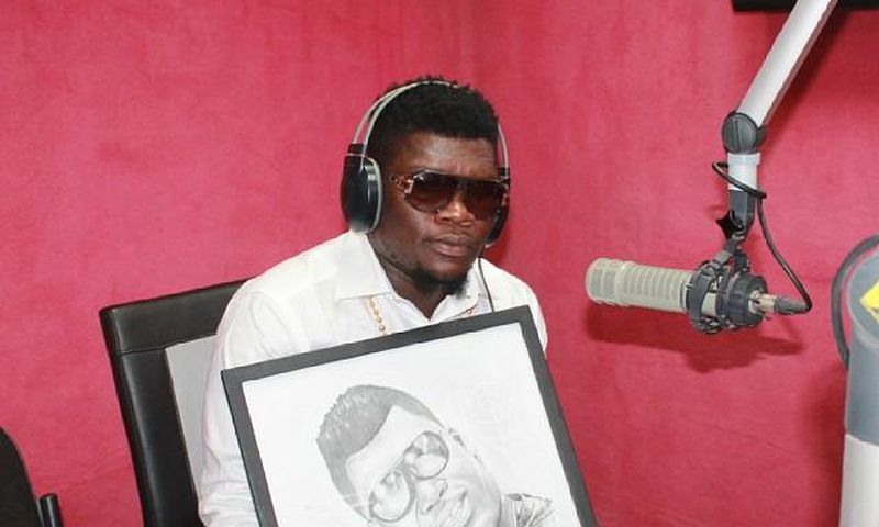 Castro Under Fire receives a portrait during a radio interview in 2014
