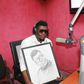 Castro Under Fire receives a portrait during a radio interview in 2014