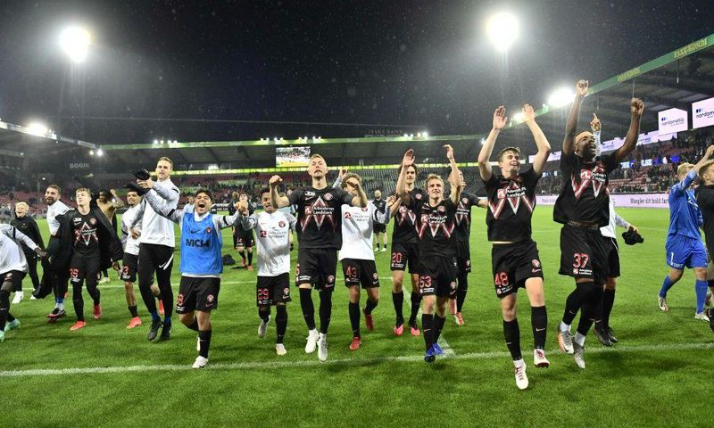 Danish delight: Midtjylland's players celebrate after defeating Celtic