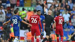 Anthony Taylor shows a red card to Chelsea defender Reece James