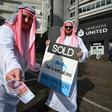 Newcastle United supporters dressed in robes outside St James's Park