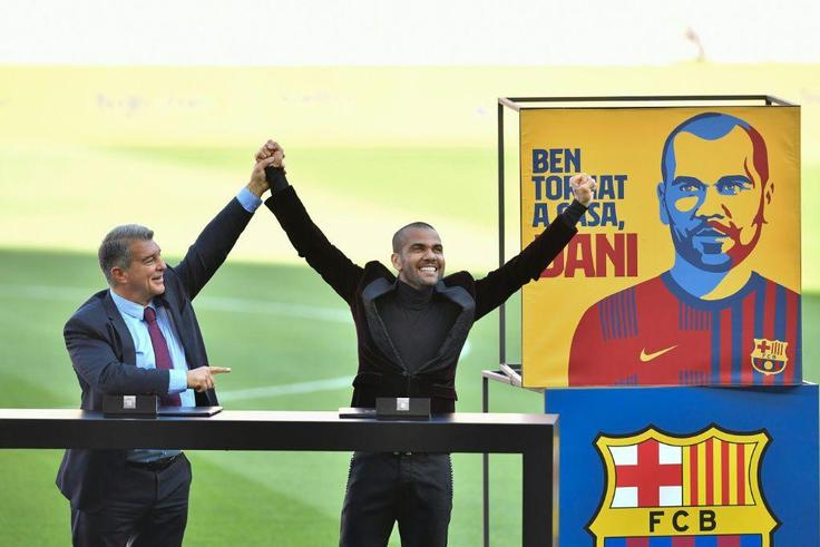 Dani Alves (right) was presented in front of Barcelona fans on Wednesday after making an incredible return to the club