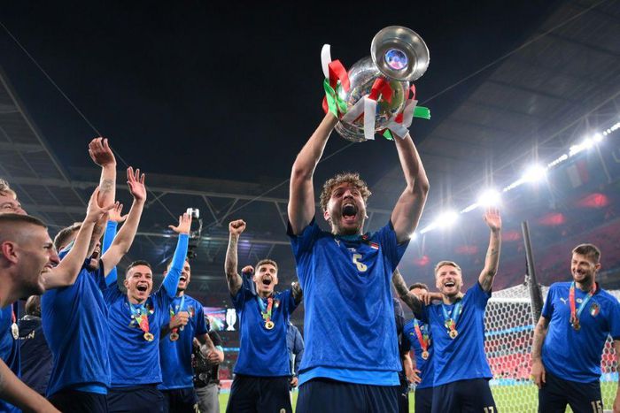 Italy midfielder Manuel Locatelli holding the Euro 2020 trophy.