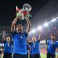 Italy midfielder Manuel Locatelli holding the Euro 2020 trophy.