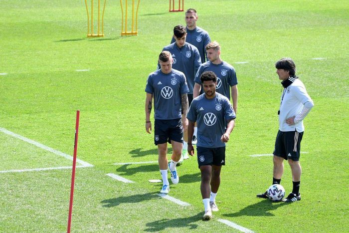 Germany coach Joachim Loew (R) oversees training in Herzogenaurach on Saturday