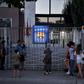 'Bombshell': Barcelona supporters gather in front of the Camp Nou stadium in Barcelona