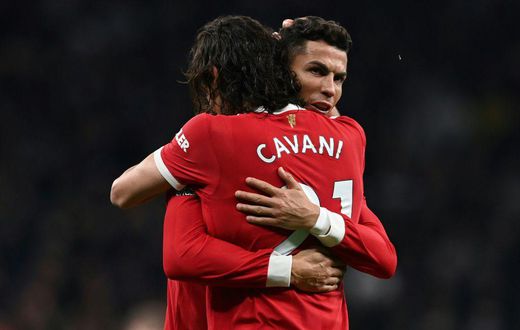 Edinson Cavani and Cristiano Ronaldo celebrate after Cavani scored Manchester United's second goal against Tottenham in a 3-0 win