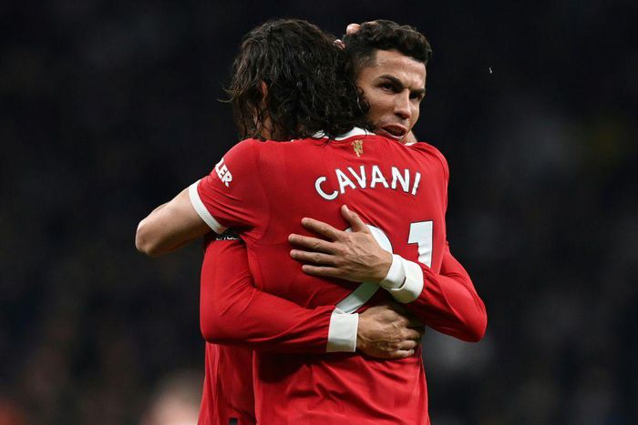 Edinson Cavani and Cristiano Ronaldo celebrate after Cavani scored Manchester United's second goal against Tottenham in a 3-0 win