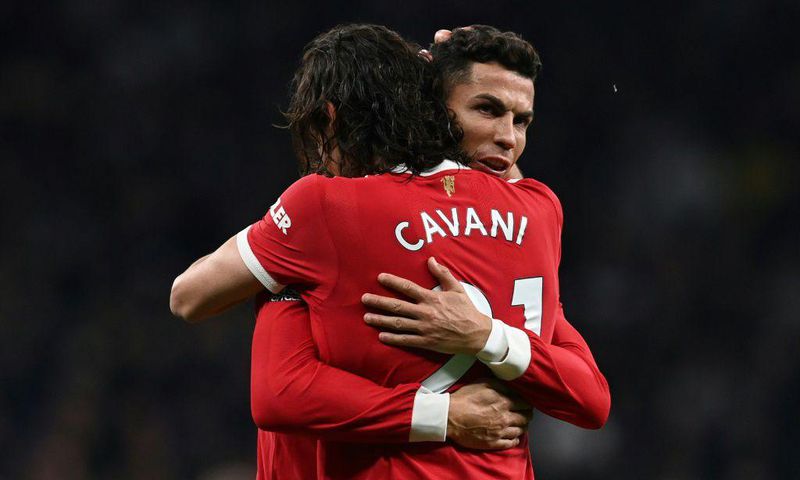 Edinson Cavani and Cristiano Ronaldo celebrate after Cavani scored Manchester United's second goal against Tottenham in a 3-0 win