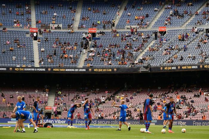 Life after Lionel: Barcelona's players warm up before the Spanish League match against Real Sociedad