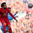 Egypt star Mohamed Salah (L) wins a heading duel during the Premier League draw between Liverpool and Manchester City at the weekend.