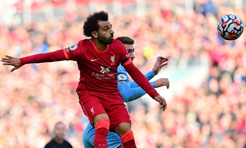 Egypt star Mohamed Salah (L) wins a heading duel during the Premier League draw between Liverpool and Manchester City at the weekend.