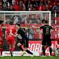 Bayern Munich striker Robert Lewandowski (C) celebrates after scoring from a free-kick at Union Berlin on Saturday